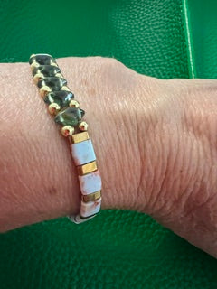 Stretch gemstone bracelet. Snakeskin Blue, gold hermatite and peridot